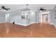 Open living room with hardwood floors and fresh gray paint shows space and updated design at 4317 S Hale Ave, Tampa, FL 33611