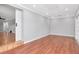 Bright living room featuring wood floors, recessed lighting, and a sliding barn door at 4317 S Hale Ave, Tampa, FL 33611