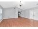 Spacious living room with wood floors and lots of natural light from windows and glass doors at 4317 S Hale Ave, Tampa, FL 33611