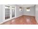 Bright living room features wood floors, natural light, and access to the outdoors at 4317 S Hale Ave, Tampa, FL 33611