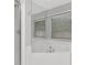 Bright bathroom with white tiled tub and shower combo with lots of natural light at 4317 S Hale Ave, Tampa, FL 33611