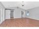 Spacious bedroom with vaulted ceiling, stylish light fixture, barn door, and ensuite bath at 4317 S Hale Ave, Tampa, FL 33611