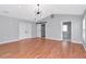 Spacious primary bedroom with modern light fixture, barn door closet, and an ensuite bathroom at 4317 S Hale Ave, Tampa, FL 33611