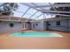 The pool is surrounded by an orange patio and features steps into the water at 4317 S Hale Ave, Tampa, FL 33611