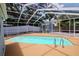 Screened-in pool area includes a pool shed, pool, and lounging space at 4317 S Hale Ave, Tampa, FL 33611
