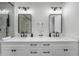 Elegant bathroom with double sinks, white cabinets, and sleek black hardware at 4913 N Nebraska Ave # 5, Tampa, FL 33603