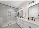 Modern bathroom featuring a glass-enclosed shower and double vanity with sleek black fixtures at 4913 N Nebraska Ave # 5, Tampa, FL 33603