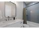 Bathroom featuring a vanity with a white countertop, a shower-tub combo, and modern decor at 4913 N Nebraska Ave # 5, Tampa, FL 33603