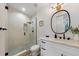 Contemporary bathroom with glass-enclosed shower, modern fixtures, and a sleek vanity with a round mirror at 4913 N Nebraska Ave # 5, Tampa, FL 33603