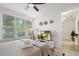 Bright bedroom with natural light, ceiling fan, neutral tones, and simple decor at 4913 N Nebraska Ave # 5, Tampa, FL 33603