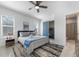 Bedroom with wood-look floors, ceiling fan, blue accents, a connecting bathroom and bunkroom at 4913 N Nebraska Ave # 5, Tampa, FL 33603