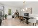 Bright dining room with a modern chandelier, hardwood floors, and stylish decor at 4913 N Nebraska Ave # 5, Tampa, FL 33603