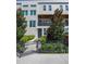 Modern townhome exterior with lush landscaping and secure fence at 4913 N Nebraska Ave # 5, Tampa, FL 33603