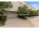 Exterior view of a townhome with a two-car garage and landscaping at 4913 N Nebraska Ave # 5, Tampa, FL 33603