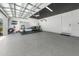 Spacious garage featuring epoxy floors, a black ceiling and a door to the main home at 4913 N Nebraska Ave # 5, Tampa, FL 33603