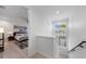 Bright upstairs hallway with a view into the bedroom and lots of natural light at 4913 N Nebraska Ave # 5, Tampa, FL 33603
