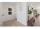 Hallway with hardwood floors, with a TV and a decorative console table at 4913 N Nebraska Ave # 5, Tampa, FL 33603