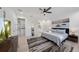 Spacious bedroom with a queen-sized bed, ceiling fan, and walk-in closet at 4913 N Nebraska Ave # 5, Tampa, FL 33603