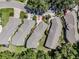 Birds eye view of home showing landscaping, driveway and surrounding community at 5224 Fairway One Dr, Valrico, FL 33596
