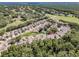 Aerial view highlighting the property's location within a lush, green community with a golf course nearby at 5224 Fairway One Dr, Valrico, FL 33596