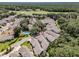 Overhead shot of neighborhood that shows house location in relation to the pool and golf course at 5224 Fairway One Dr, Valrico, FL 33596