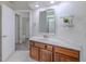 Bathroom featuring modern vanity and door leading to a shower and tub area at 5224 Fairway One Dr, Valrico, FL 33596