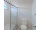 Clean and bright shower room features a glass door shower and a toilet at 5224 Fairway One Dr, Valrico, FL 33596