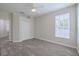 Bedroom with neutral carpet, closet and a view through to the bathroom at 5224 Fairway One Dr, Valrico, FL 33596