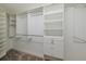 Well-organized closet with multiple shelves, hanging rods, and built-in drawers at 5224 Fairway One Dr, Valrico, FL 33596