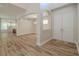 A stylish entryway featuring a double door entry, high ceilings and hardwood floors at 5224 Fairway One Dr, Valrico, FL 33596