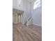 The foyer features a staircase, hardwood floors, and lots of natural light at 5224 Fairway One Dr, Valrico, FL 33596