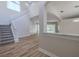 The foyer features a staircase, hardwood floors, high ceilings and lots of natural light at 5224 Fairway One Dr, Valrico, FL 33596