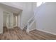 The foyer has hardwood floors, a staircase with white wooden trim, and lots of natural light at 5224 Fairway One Dr, Valrico, FL 33596