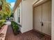 Inviting front entry with double doors, brick pavers, and garden at 5224 Fairway One Dr, Valrico, FL 33596