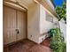 Inviting front entry with double doors, brick pavers, and garden at 5224 Fairway One Dr, Valrico, FL 33596