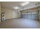 Spacious two car garage with epoxy flooring, water heater, and automatic door at 5224 Fairway One Dr, Valrico, FL 33596