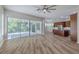 Spacious living area with access to the kitchen and screened-in patio at 5224 Fairway One Dr, Valrico, FL 33596
