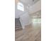 Living room with staircase and view to patio at 5224 Fairway One Dr, Valrico, FL 33596