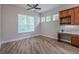 A study with wood cabinets, marble countertop, and large windows for natural light at 5224 Fairway One Dr, Valrico, FL 33596
