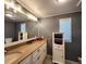 Spacious bathroom with a long vanity, elegant fixtures, and modern design at 5258 Wisteria Cir, New Port Richey, FL 34653
