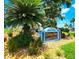 Colony Cove welcome sign surrounded by lush greenery and flowers at 5258 Wisteria Cir, New Port Richey, FL 34653