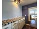 A custom countertop sits atop shaker cabinets with stylish pulls and is lit by a modern light fixture at 5258 Wisteria Cir, New Port Richey, FL 34653