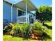 Attractive home exterior featuring a well-maintained lawn and charming plants at 5258 Wisteria Cir, New Port Richey, FL 34653