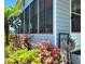 Exterior home view of a home with beautiful landscaping at 5258 Wisteria Cir, New Port Richey, FL 34653