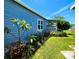 Charming exterior view of the home with landscaping and a covered porch at 5258 Wisteria Cir, New Port Richey, FL 34653