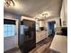A modern kitchen is fitted with stainless steel appliances, white shaker cabinets, and stylish countertops at 5258 Wisteria Cir, New Port Richey, FL 34653