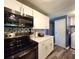 Modern kitchen features updated appliances, white cabinetry and stylish backsplash at 5258 Wisteria Cir, New Port Richey, FL 34653
