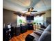 Living room offers wood floors and view of the well-lit windows at 5258 Wisteria Cir, New Port Richey, FL 34653