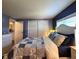 Main bedroom boasts large closet, wood floor and ensuite bath access at 5258 Wisteria Cir, New Port Richey, FL 34653