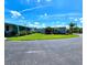Street view showcasing well-maintained homes with landscaped yards and mature trees at 5258 Wisteria Cir, New Port Richey, FL 34653